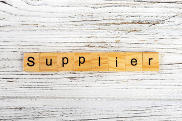 Wall Mural - SUPPLIER word made with wooden blocks concept