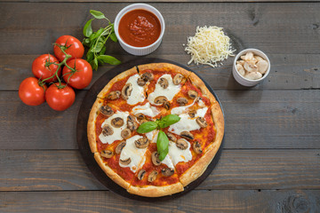 Fresh Pizza on Wood Table