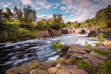 Wall Mural - River Tees and Low Force Waterfall / The River Tees cascades over the Whin Sill at Low Force Waterfall, as the Pennine Way follows the southern riverbank