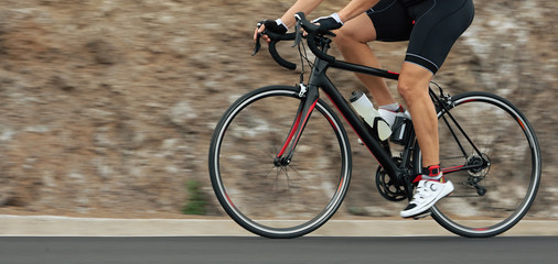 Motion blur of a bike race with the bicycle and rider at high speed