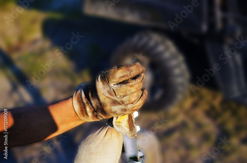 Fotografija Hard working lifestyle shown with close up of work glove on fence post