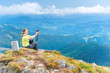 © Pavlo Vakhrushev - Young woman taking selfie on camera