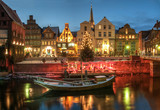 Fototapeta Uliczki - Snow- and Christmasscenery by night, Lüneburg, near Hamburg, Germany.