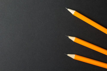 Engineering pencils on a black background, empty space for text.