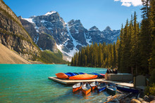 Canoes On A Jetty At  Moraine Lake In Banff National Park, Canada