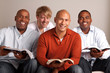 Diverse group of men studying together.