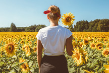 Beautiful Stylish Hippie Girl On The Sunflower Field