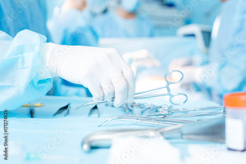 Fényképezés  Close up of hand that taking scissors