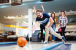 © NDABCREATIVITY - Friends bowling at club