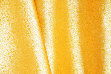 Beautiful Gold Silk. Drapery Textile Background,