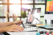 © Prathankarnpap - graphic design desk hand using mouse pan sketch device on creative desk.