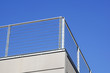 Balcony with white parapet of the blue sky