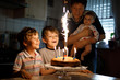 © Irina Schmidt - Little kid boy and family, father, brother and baby sister celebrating birthday
