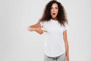 Canvas Print - Shocked young woman with curly hair