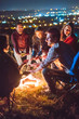 © realstock1 - The smile people hold hands near the bonfire. night time