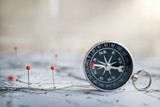 Fototapeta Mapy - Retro compass on ancient map background. Travel geography navigation concept background.