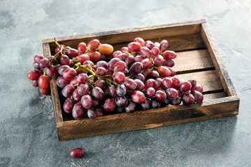 Wall Mural - Grapes in wooden box, autumn organic harvest, healthy eating, fresh vegan vitamins