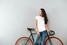 Smiling Pretty Asian Woman Leaning On A Bicycle