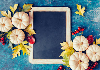 Wall Mural - white pumpkins and fall leaves.