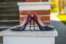 Bridal Accessories - Bordeaux Colour Bride Shoes On Stair Railings