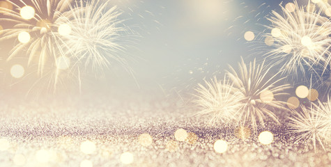 Wall Mural - Gold and green Vintage Fireworks and bokeh in New Year eve and copy space. Abstract background holiday.