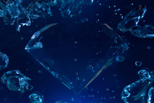 Photo Of A Blue Diamond In Water With Bubbles Floating.