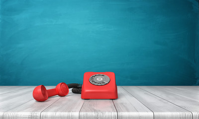 Wall Mural - 3d rendering of a bright red dial phone standing on a wooden desk and a blue wall background.