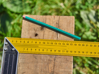 Builder drawing on a wooden board