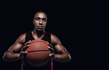 Wall Mural - The portrait of a basketball player with ball