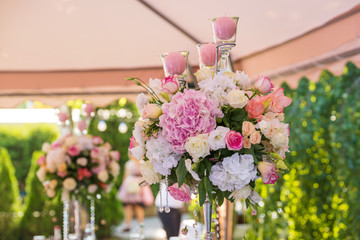 floral wedding decorations pink and white. Garland, candle, lace, bouquet