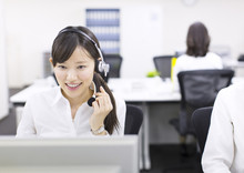 Young Businesswoman With Headset At Call Center 