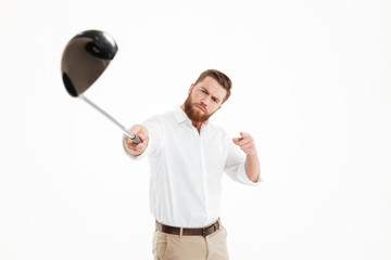 Wall Mural - Young bearded man holding golfstick.