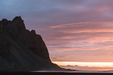 Sunrise At Stokksnes Beach Iceland With Mountain And Orange And Purple Clouds