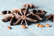 Whole star anise on blue wooden background,