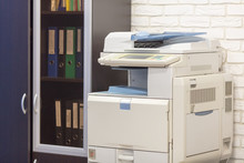 Big Multifunction Printer In Office Near Wall