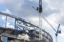 Construction Cranes On Building Site