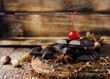 © WildDago - pieces of chocolate with nuts and cinnamon