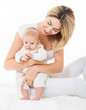 © Svetlana Fedoseeva - Mother and baby playing and smiling. Happy family. Isolated,