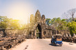 Tuk tuk and angkor thom gate in siem reap cambodia