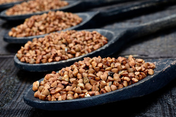 buckwheat in spoon on table