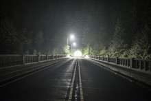 View Of Empty Road Passing Through Tunnel During Night