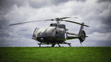 Black helicopter standing on the green grass