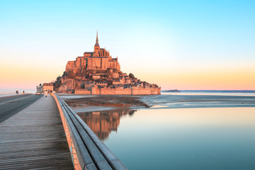 Wall Mural - Morning light on Mont Saint Michel and it's reflection in Normandy - France