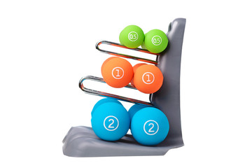 Wall Mural - Set of colored isolated dumbbells for sport on a white background folded on a special gray stand