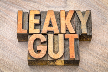 Wall Mural - Leaky gut word abstract in wood type