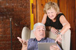 © Mego-studio - Old couple using tablet.