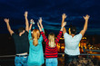 © Stock Rocket - Friends standing together on terrace