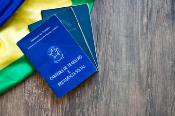 Brazilian work document and social security on the Brazilian flag on the wooden table