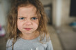 © Courtney Rust/Stocksy - Young girl giving silly faces