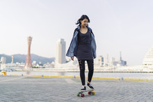 Attractive Young Asian Woman Skating In Kobe Japan
